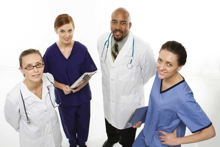 doctors-nurses-four-man-women-looking-up Group of Doctors