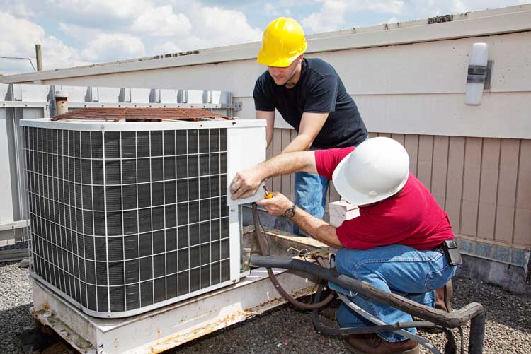 heating-hvac-air-conditioner-ac-cooling-repair HVAC Contractors, two men working on an air conditioner